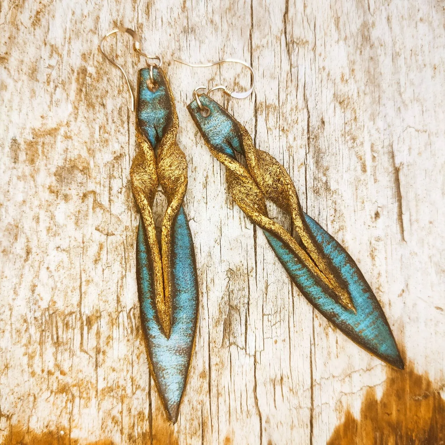 Handmade turquoise leather earing with brown wash and gold, you can wear it in both sides, you get two beautiful earings in one.