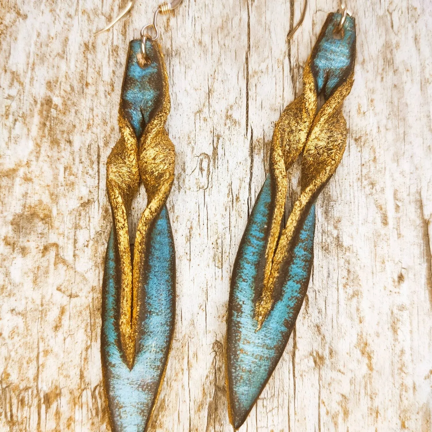 Handmade turquoise leather earing with brown wash and gold, you can wear it in both sides, you get two beautiful earings in one.